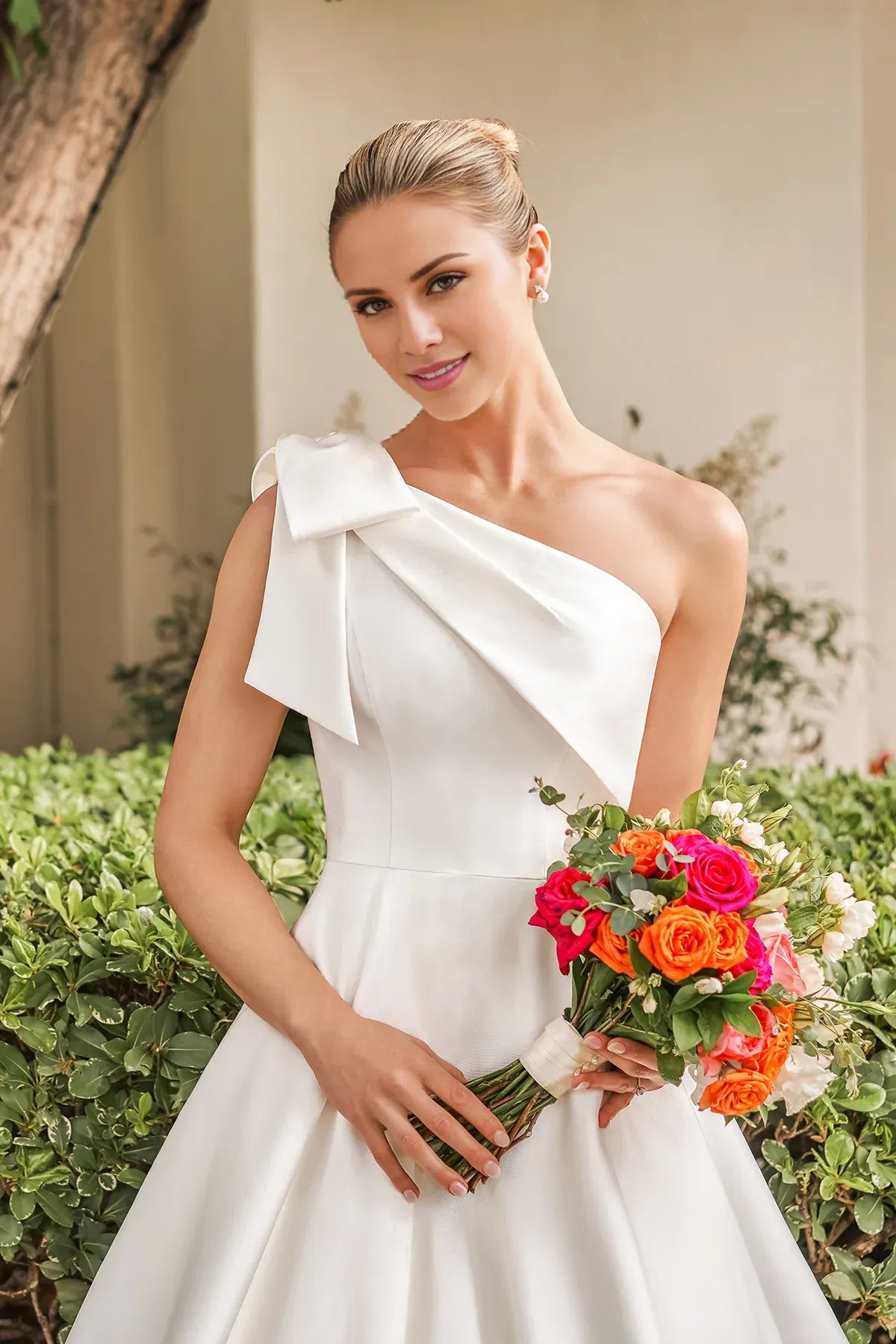 Elegant One‑Shoulder Satin Bow A‑Line Low Back Pocket Pearl Train Garden Wedding Dress
