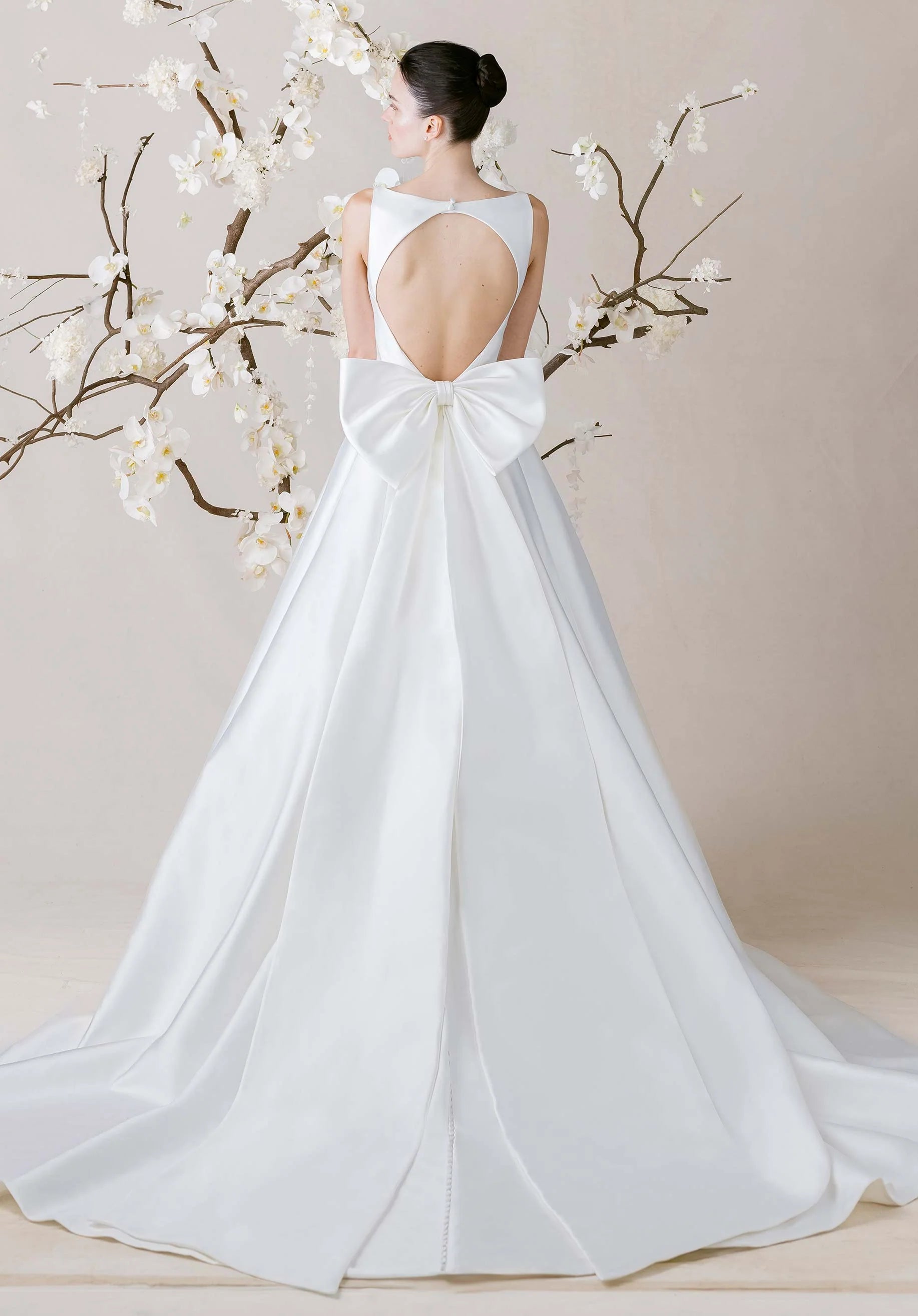 Modern Satin Ball Gown Wedding Dress with Keyhole Back and Oversized Bow Detail