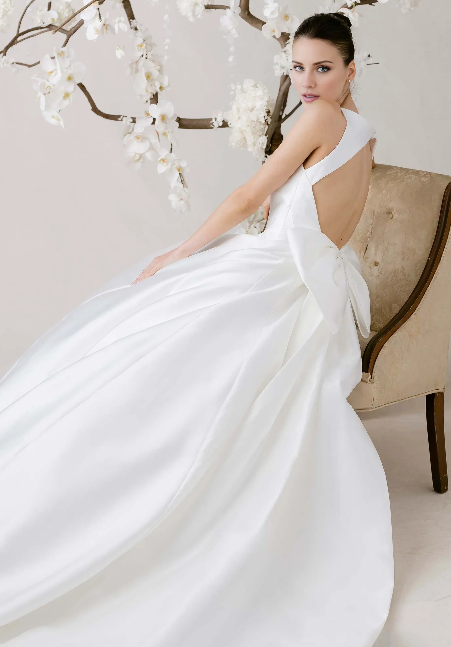 Modern Satin Ball Gown Wedding Dress with Keyhole Back and Oversized Bow Detail